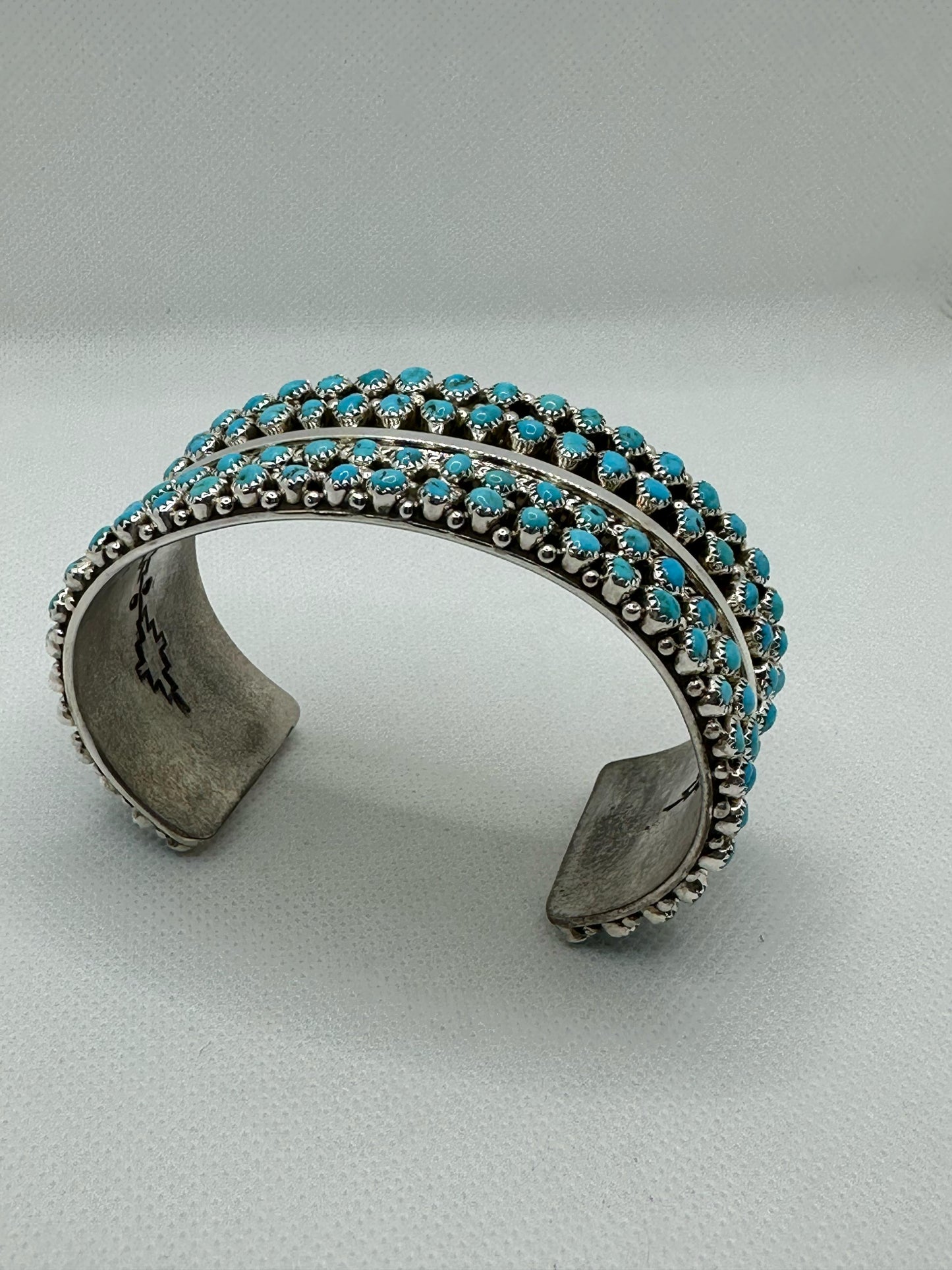 Turquoise Navajo handmade sterling silver bracelet .